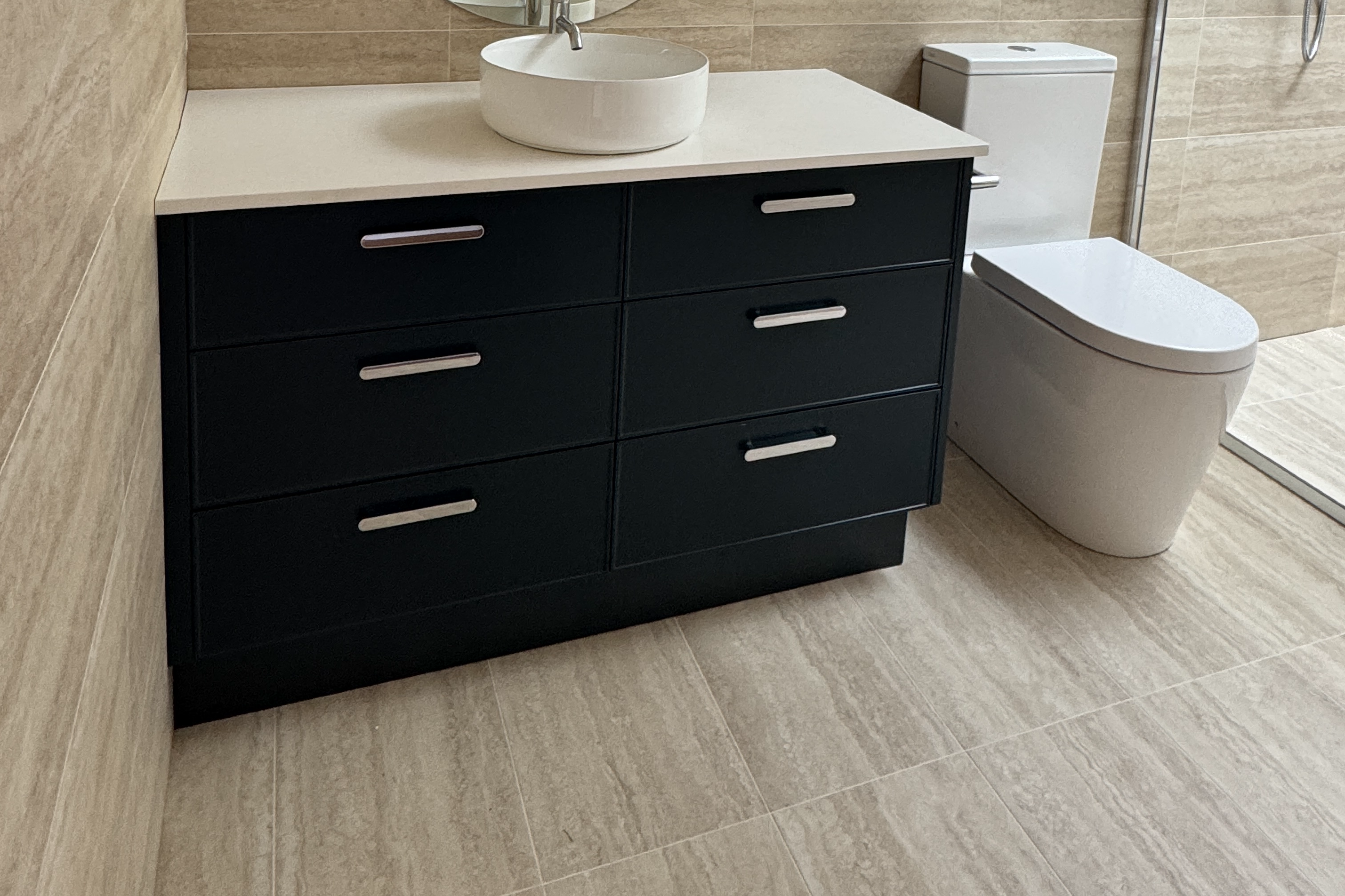 Charcoal vanity with vessel basin